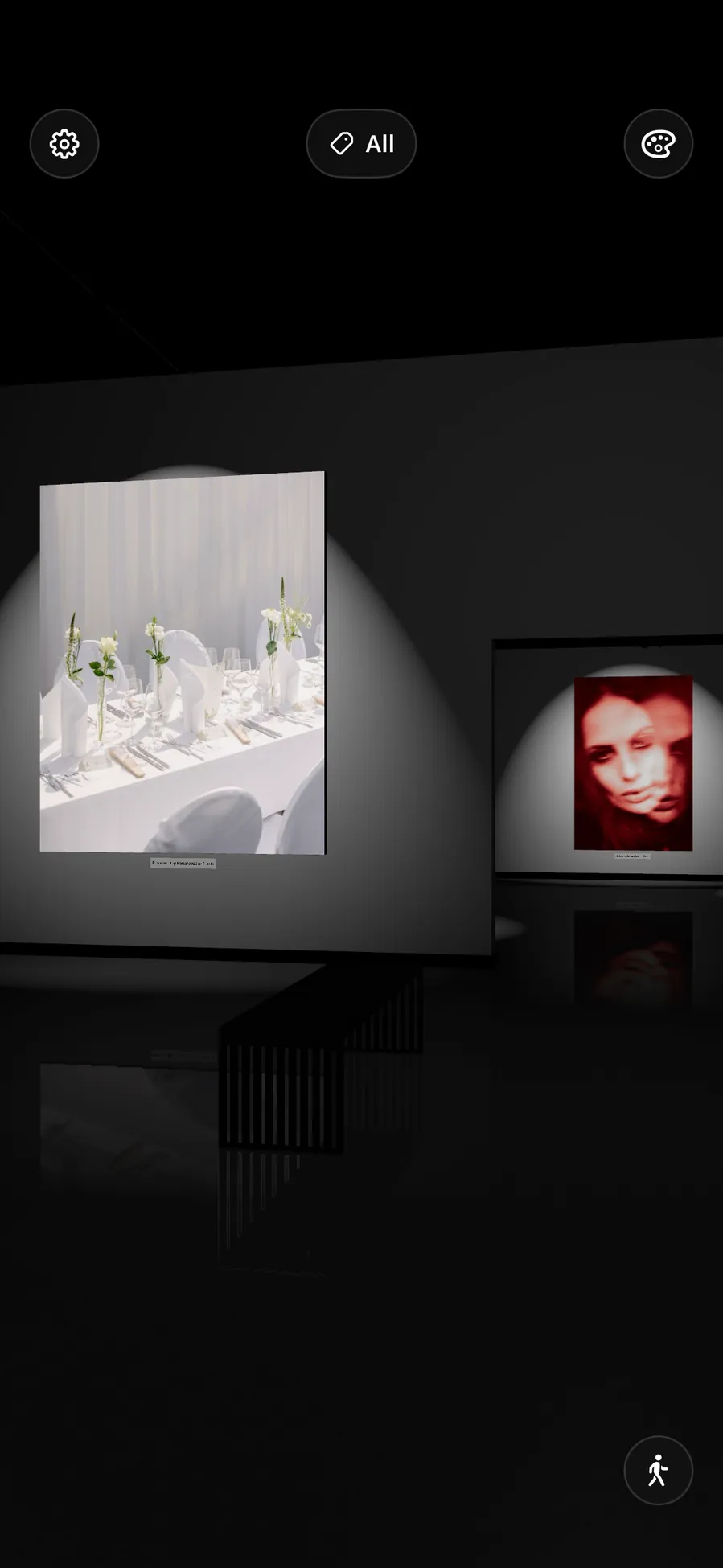 A dark room with a single lit canvas ahead